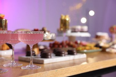 Buffet menu. Delicious desserts and drinks on table, selective focus