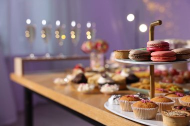 Buffet menu. Different delicious desserts on table, selective focus