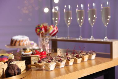 Buffet menu. Delicious desserts and drinks on table, selective focus