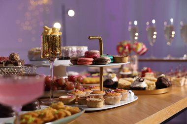 Buffet menu. Different delicious desserts on table, selective focus