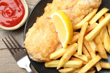 British Traditional Fish and chips served on wooden table, flat lay