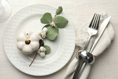 Beautiful table setting with autumn decor on white wooden background, flat lay