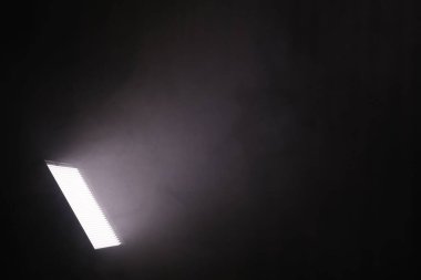 Professional lighting equipment without reflector and smoke on dark background. Space for text