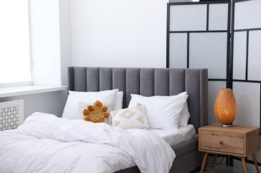 Beautiful room with comfortable bed. Interior design