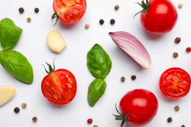 Fresh ripe tomatoes, basil, garlic and peppercorns on white background, flat lay