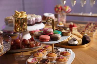 Buffet menu. Different delicious desserts on table, selective focus