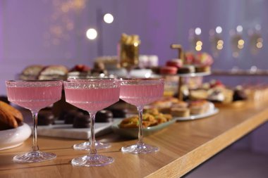 Buffet menu. Delicious desserts and drinks on table, selective focus