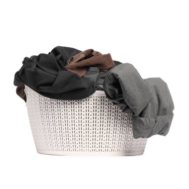Plastic laundry basket full of clothes isolated on white