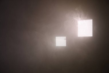 Professional lighting equipment without reflector and smoke on dark background. Space for text