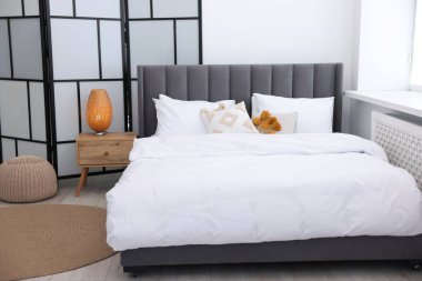 Beautiful room with comfortable bed. Interior design