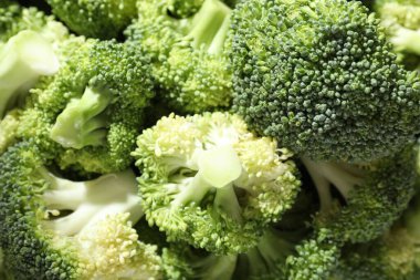 Fresh green broccoli as background, closeup view