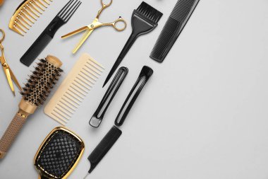 Different hair styling tools on white background, flat lay. Space for text