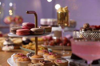 Buffet menu. Different delicious desserts on table, selective focus