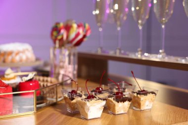 Buffet menu. Delicious desserts and drinks on table, selective focus