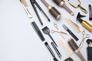 Different hair styling tools on white background, flat lay. Space for text