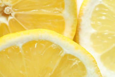 Arka plan olarak taze limon parçaları, makro görünüm