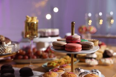 Buffet menu. Different delicious desserts on table, selective focus
