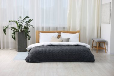 Beautiful room with comfortable bed. Interior design