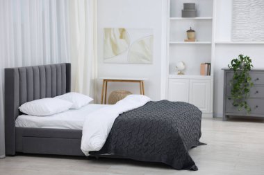 Beautiful room with comfortable bed. Interior design