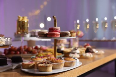 Buffet menu. Different delicious desserts on table, selective focus