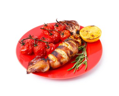 Tasty stuffed squid, rosemary, lemon and tomatoes isolated on white