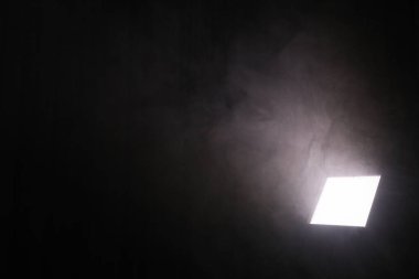 Professional lighting equipment without reflector and smoke on dark background. Space for text