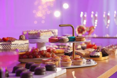 Buffet menu. Different delicious desserts on table, selective focus