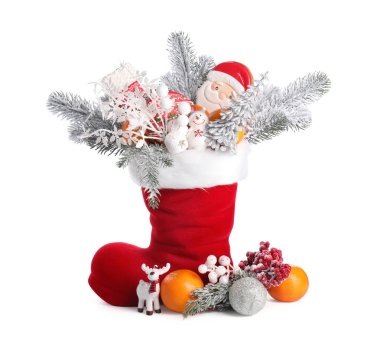 Saint Nicholas day. Red boot with treats and festive decor isolated on white