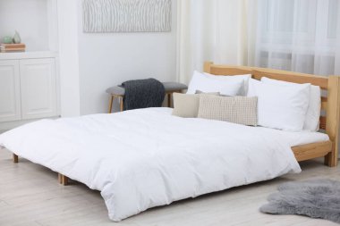 Beautiful room with comfortable bed. Interior design