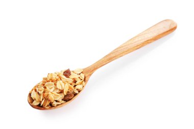 Beyaz kaşık içinde kurutulmuş meyveli lezzetli granola.