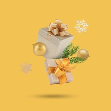 Noel ya da yeni yıl kutlaması. Altın arka planda uçan hediye kutuları ve şenlikli dekorlar