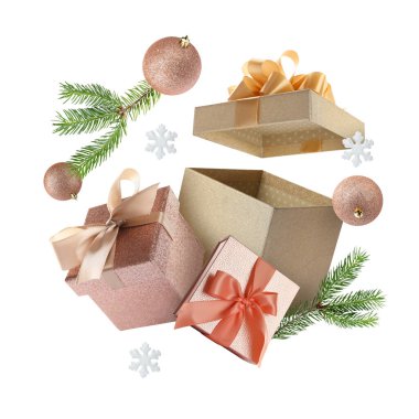 Noel ya da yeni yıl kutlaması. Beyaz arka planda uçan hediye kutuları ve şenlikli dekorlar