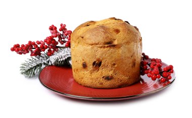 Noel yemeği. Lezzetli Panettone pastası ve beyaz üzerine izole edilmiş şenlikli dekor.