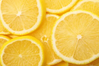 Arka plan olarak taze limon dilimleri, üst görünüm