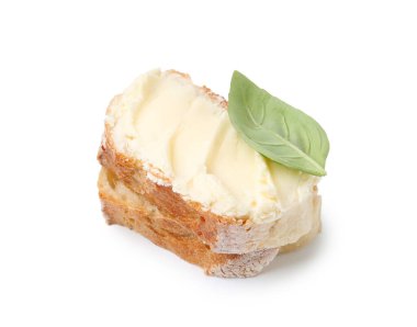 Beyaz üzerine yağlı ve fesleğenli baget dilimleri.