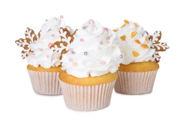 Beyaz üzerine Noel süsü konmuş lezzetli kekler.