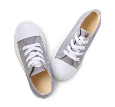 Gri çocuğun spor ayakkabıları beyaz manzarada izole edilmiş. Şık ayakkabılar.