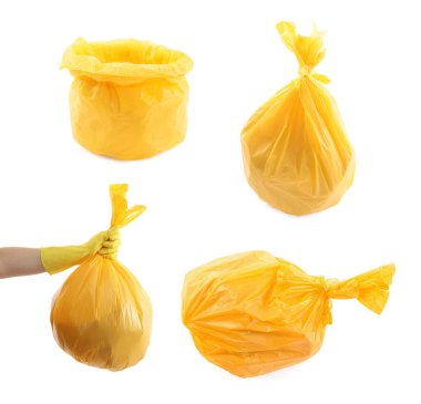 Beyazda izole edilmiş çöpler için sarı plastik poşetler.