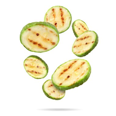 Izgara kabak parçaları beyaz arka plana düşüyor.