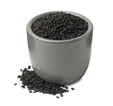 Beyaz kasedeki siyah kimyon tohumları.