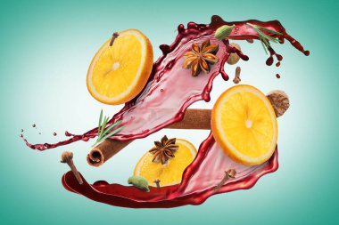 Sıcak şarap sıçraması, baharatlar ve turkuaz arka planda portakal dilimleri.