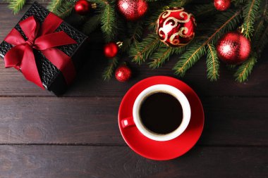Aromatic coffee, gift and Christmas decor on wooden table, flat lay