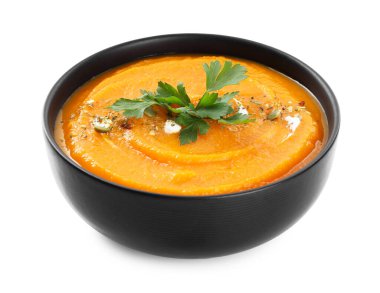 Lezzetli balkabağı kremalı çorba, maydanozlu ve beyaz tencereli.