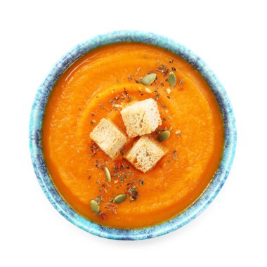 Çekirdekli balkabağı kremalı çorba ve kabın içinde kızarmış ekmek.