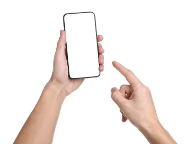 Man holding smartphone with blank screen on white background, closeup. Mockup for design