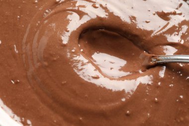 Sıvı çikolata hamuru ve kaşık arka plan olarak, üst görünüm