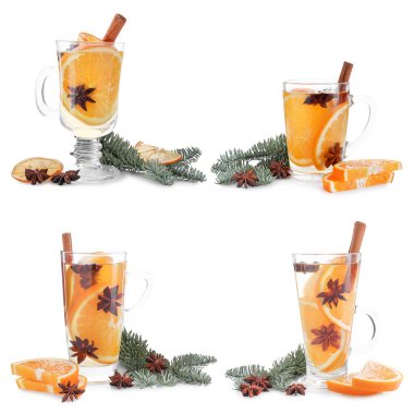 Cam bardaklarda sıcak şarap ve beyaz üzerine izole edilmiş köknar dalları.