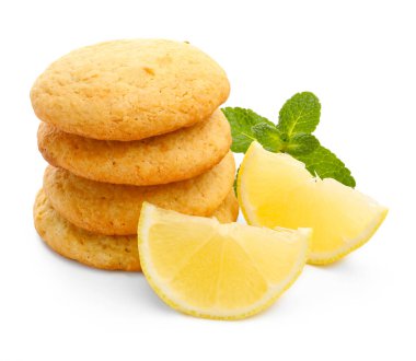 Lezzetli limonlu kurabiye, nane ve beyaz üzerine izole edilmiş meyve dilimleri.