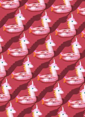 Noel desenli topların koyu pembe arka planda tek boynuzlu at şeklinde dizaynı