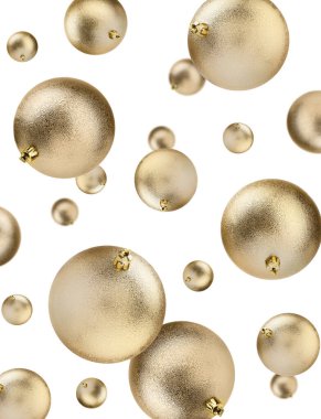 Noel topları beyaz arka planda havada uçuşuyor. Şenlikli süsler